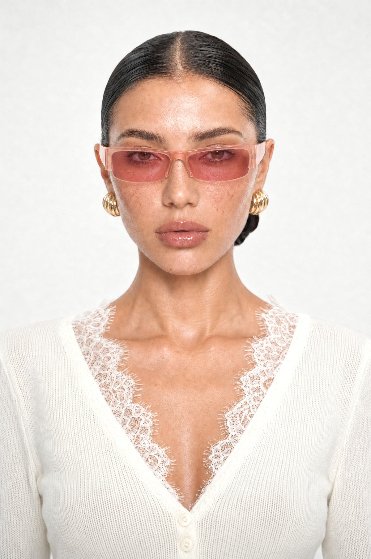 The Barnes Rectangle Sunglasses in Blush, worn, front