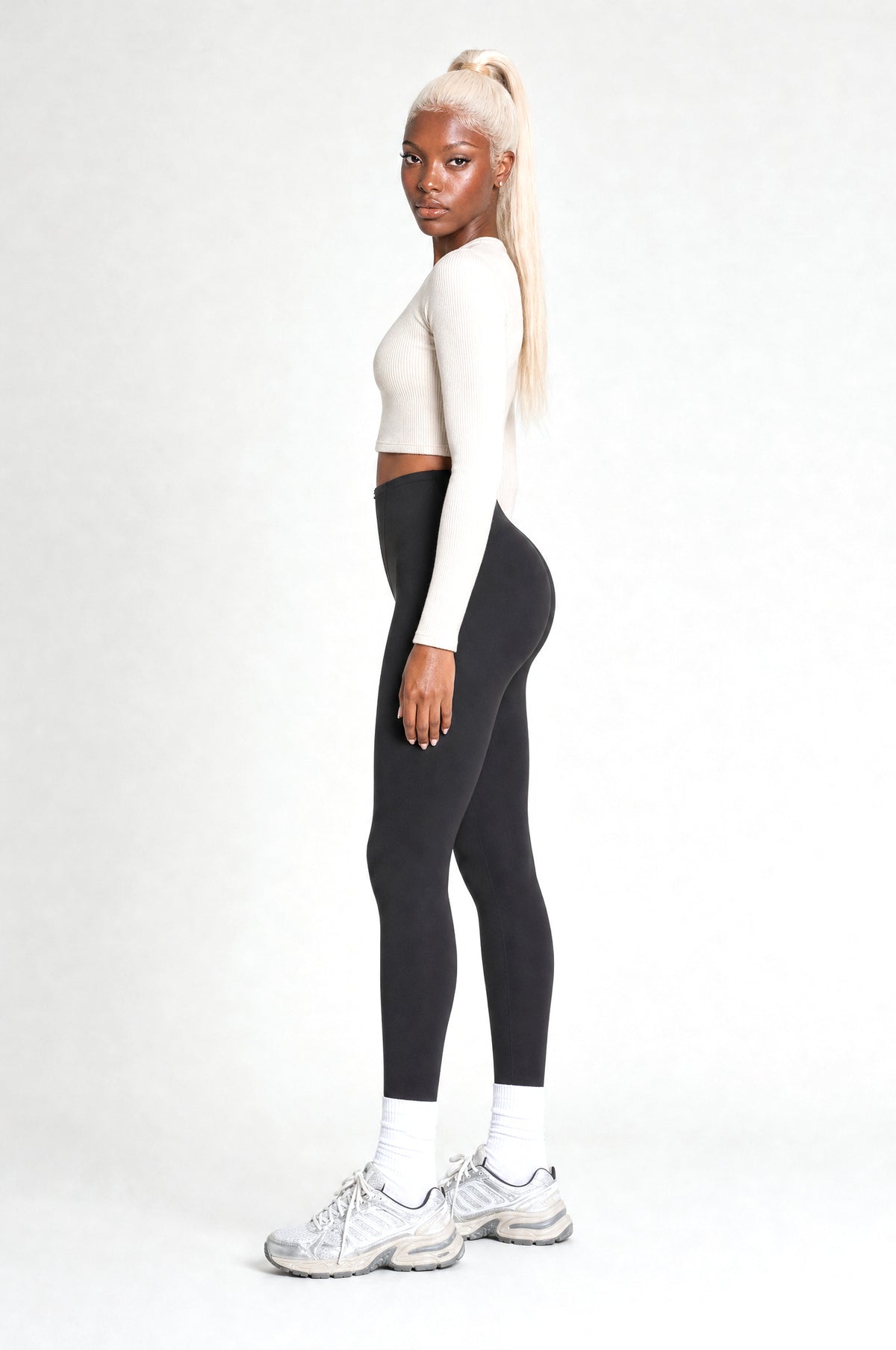 The Regent Tummy-Control Leggings in Black, side view showing the flat tummy and lifted seat