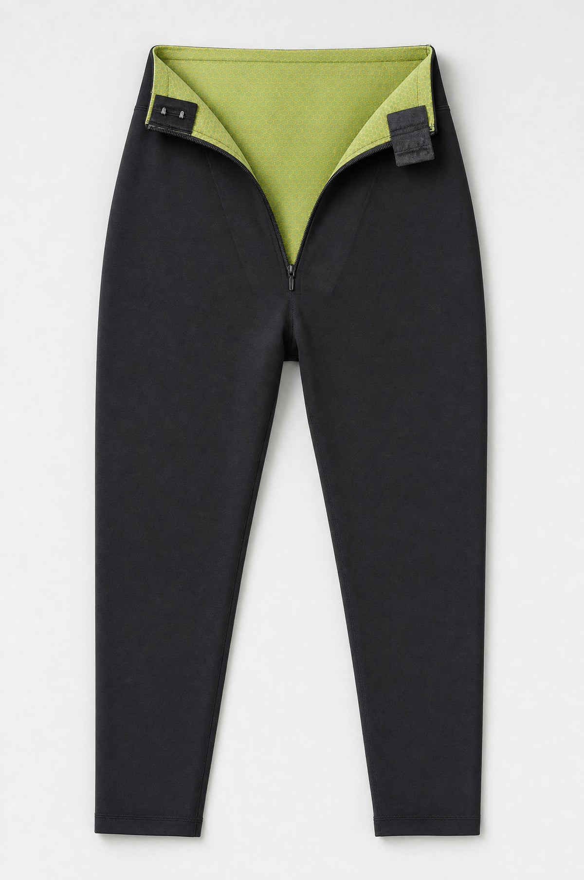 The Regent Tummy-Control Leggings laid flat, waistband folded to show the green inner shaping layer