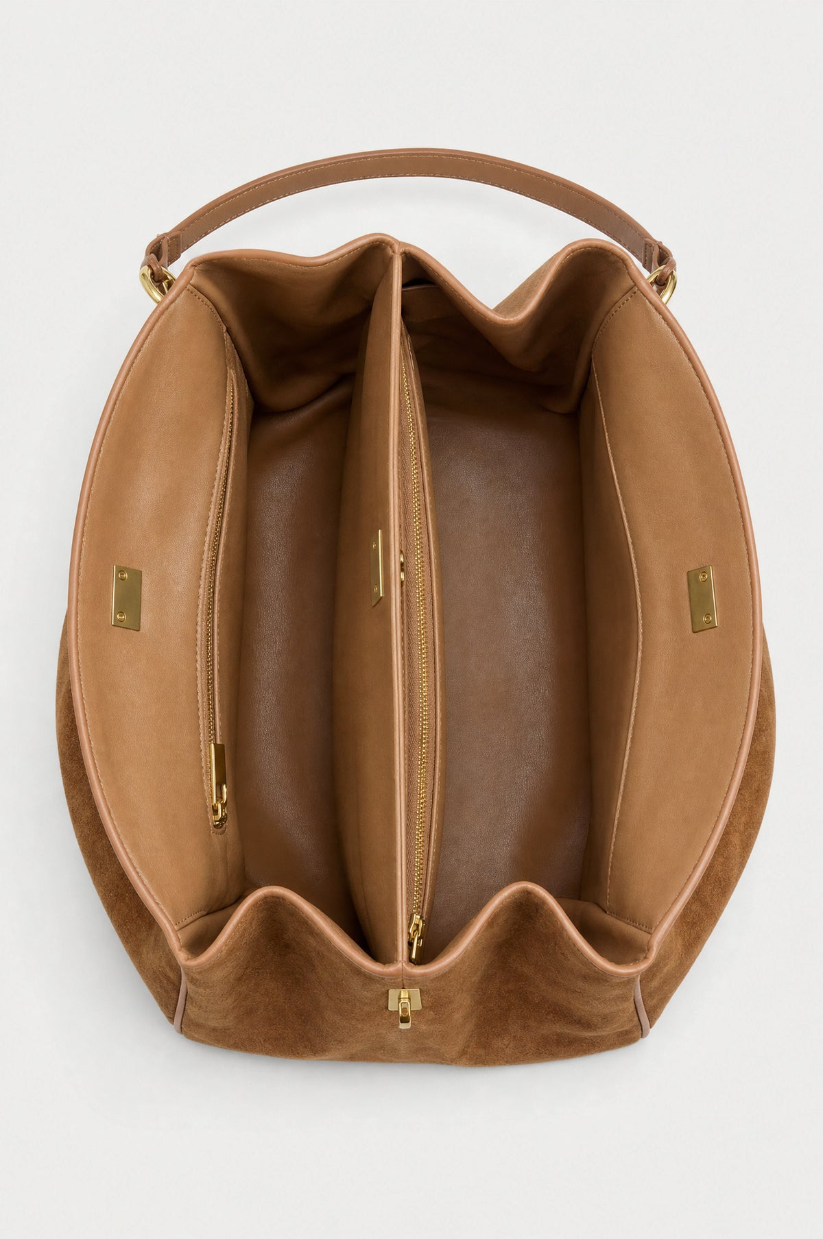 The Kensington Top-Handle Bag in Caramel, inside, two compartments and a zipped divider
