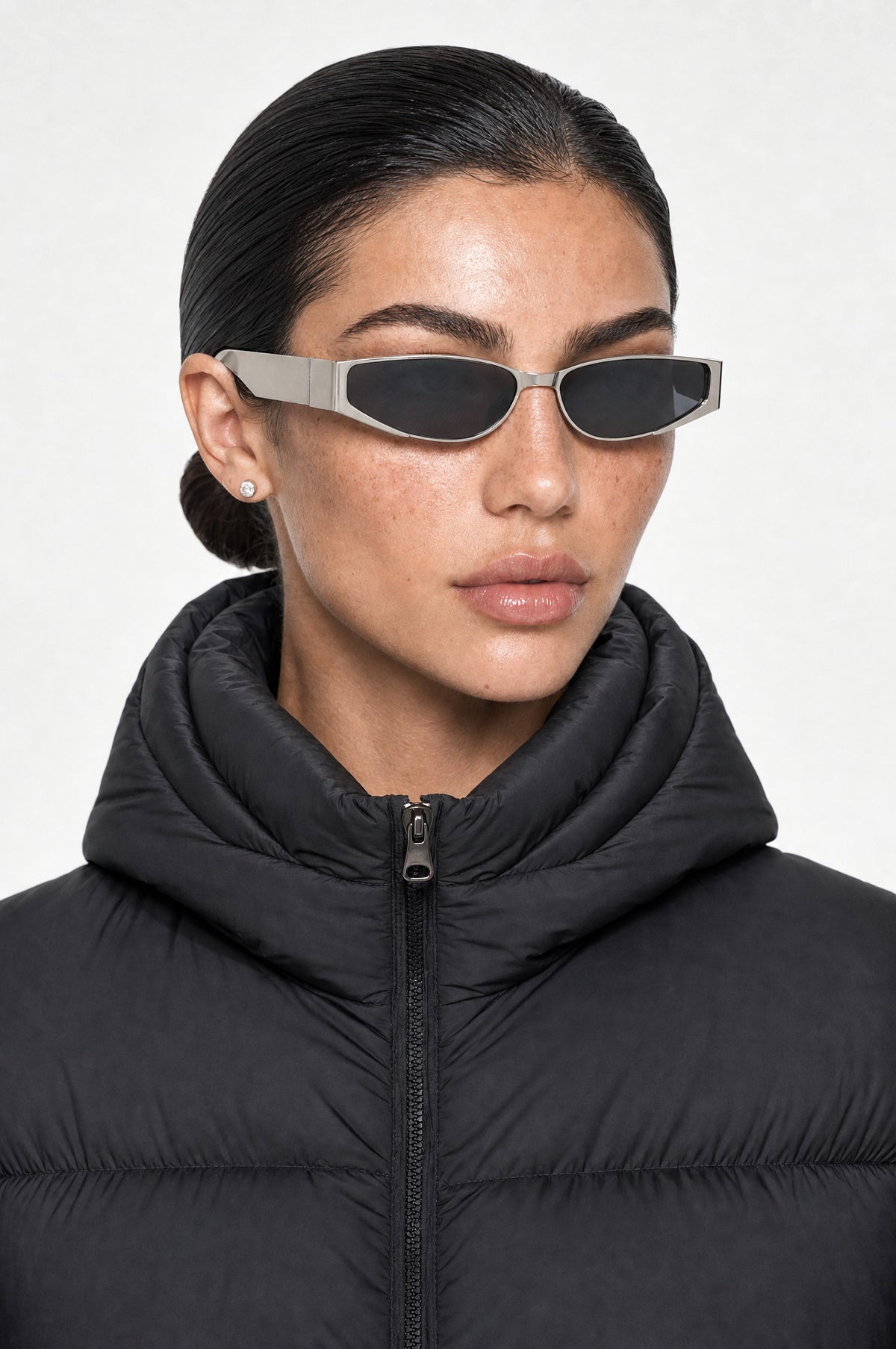 The Putney Wrap Sunglasses in Silver, worn, three-quarter