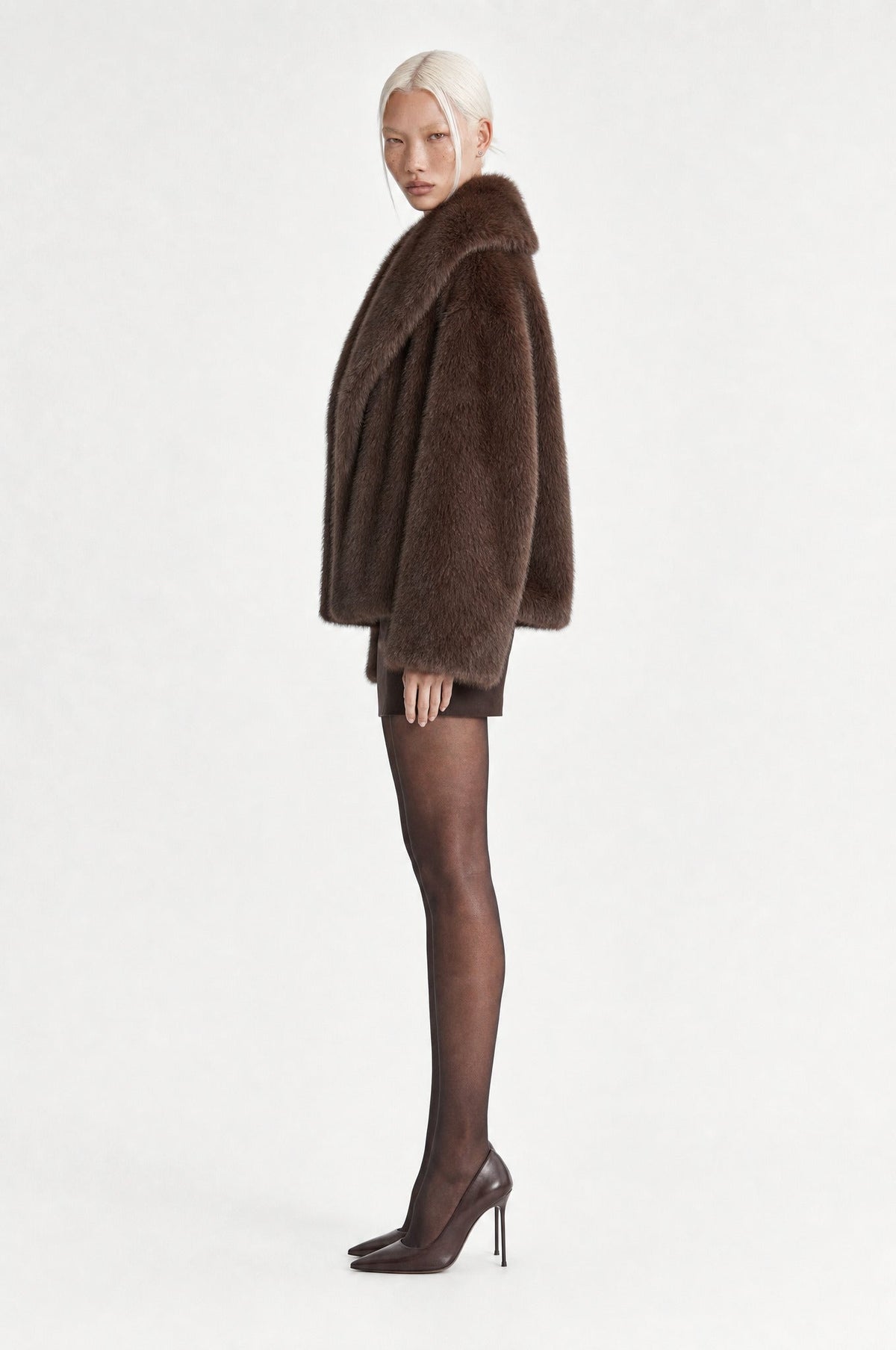 The Belgravia Faux Fur Jacket in Coffee, side, looking at camera