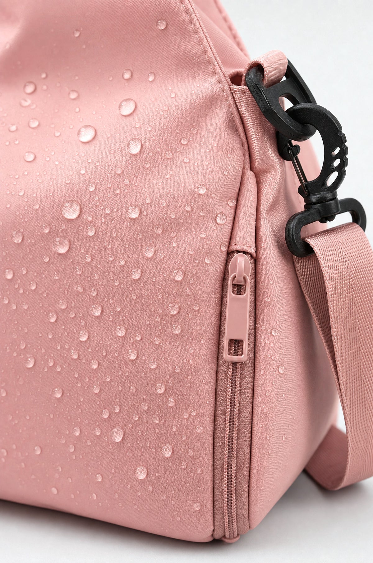 The Greenwich Travel Bag in Pink, splash-resistant nylon