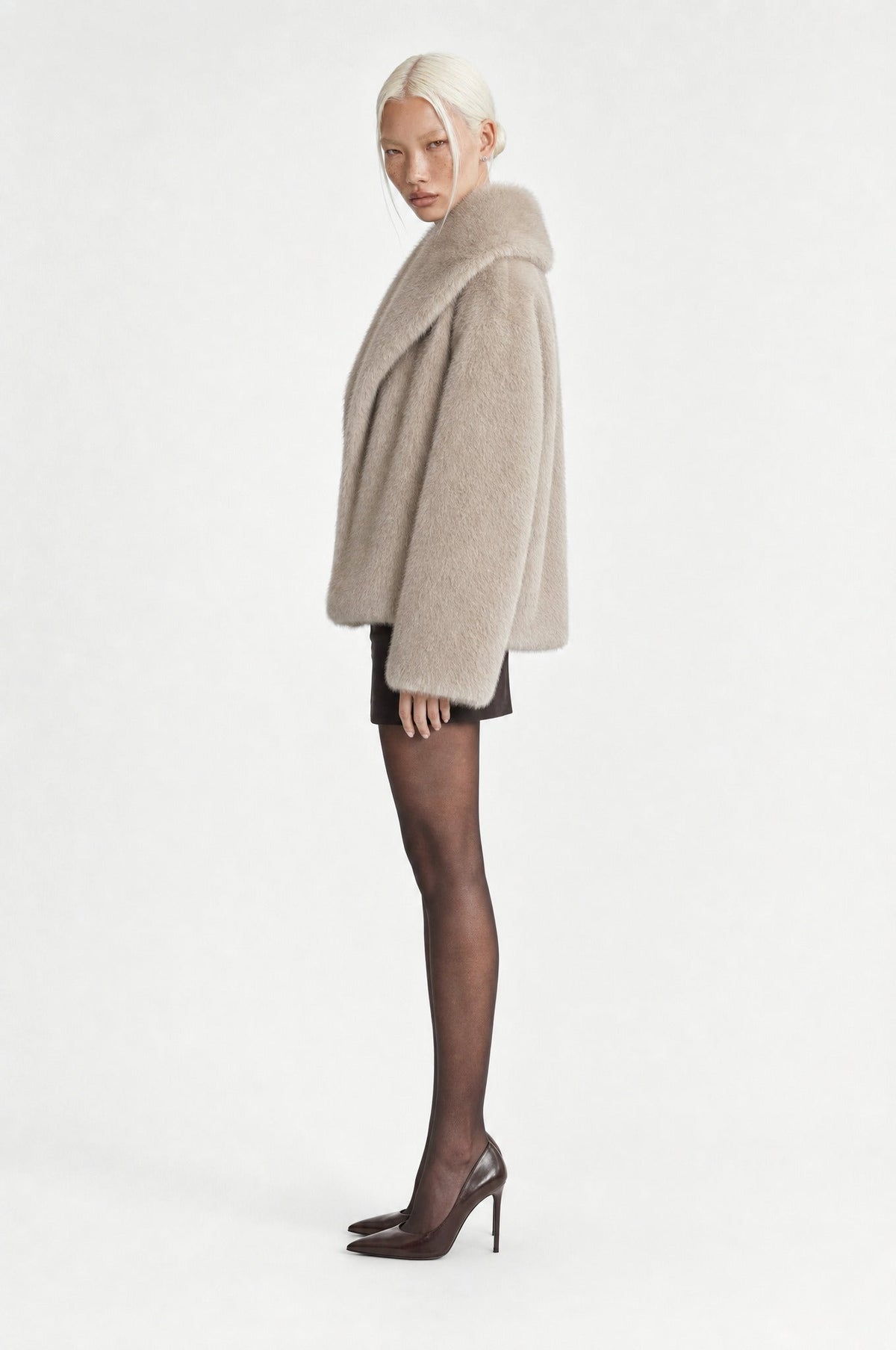 The Belgravia Faux Fur Jacket in Beige Grey, side, looking at camera