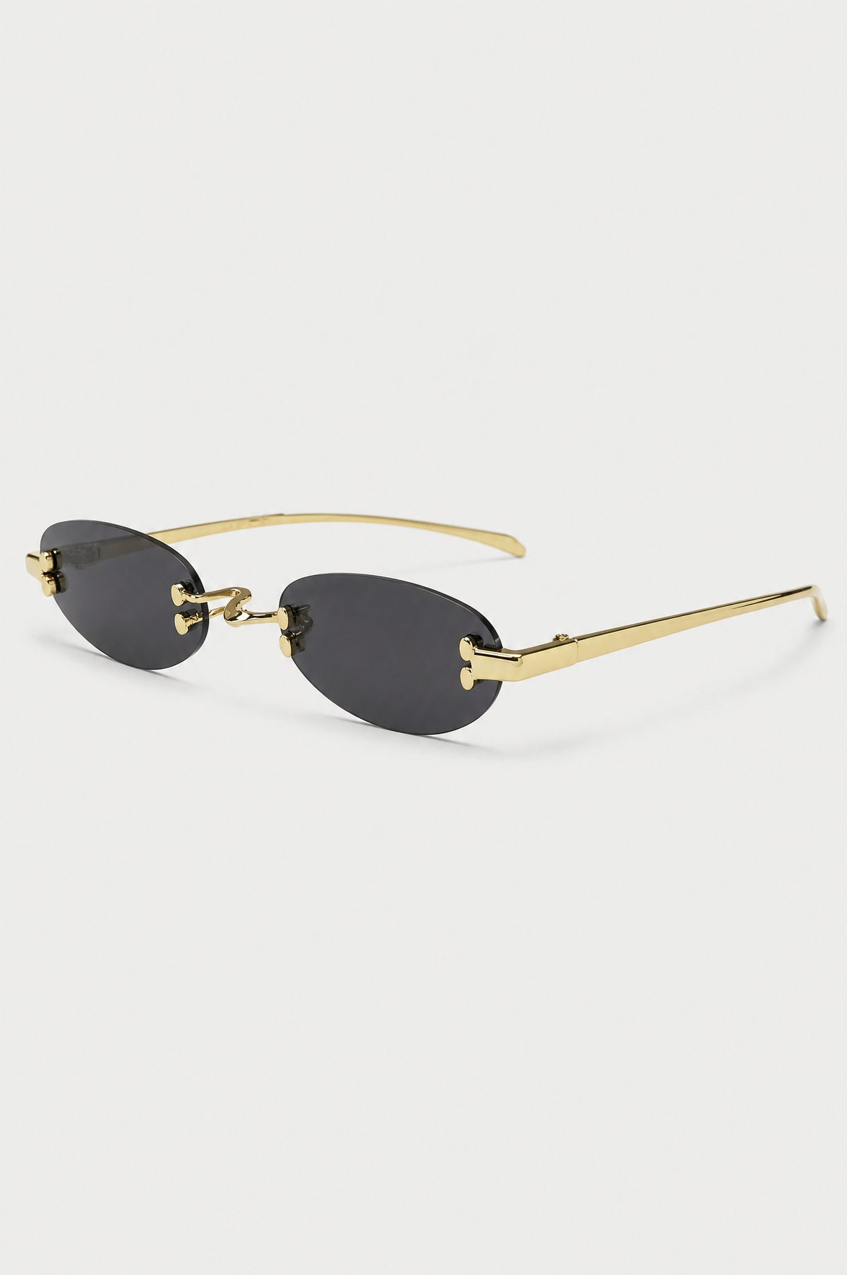The Chiswick Oval Sunglasses in Gold Black, three-quarter view