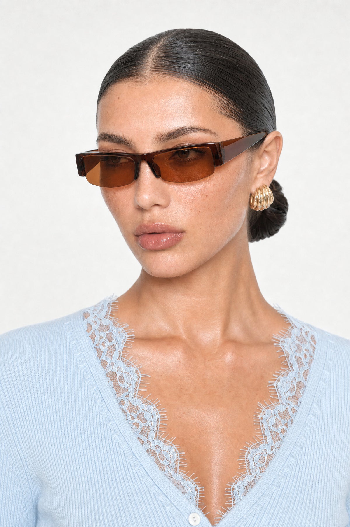 The Barnes Rectangle Sunglasses in Brown, worn, three-quarter