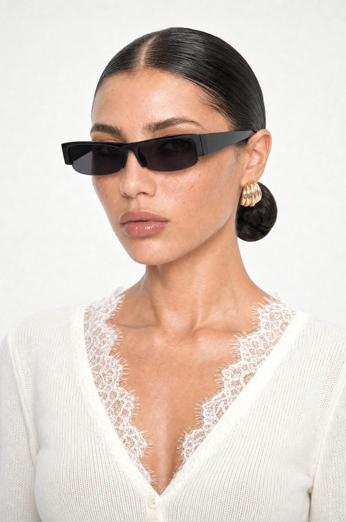 The Barnes Rectangle Sunglasses in Black, worn, three-quarter