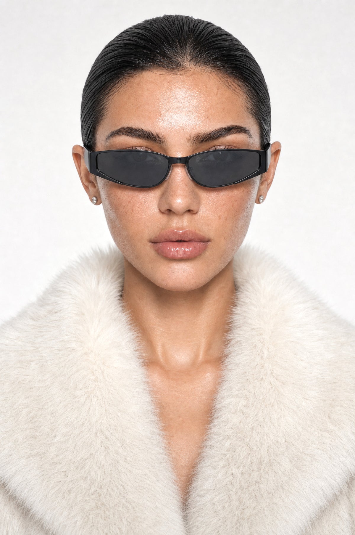 The Putney Wrap Sunglasses in Black, worn, front