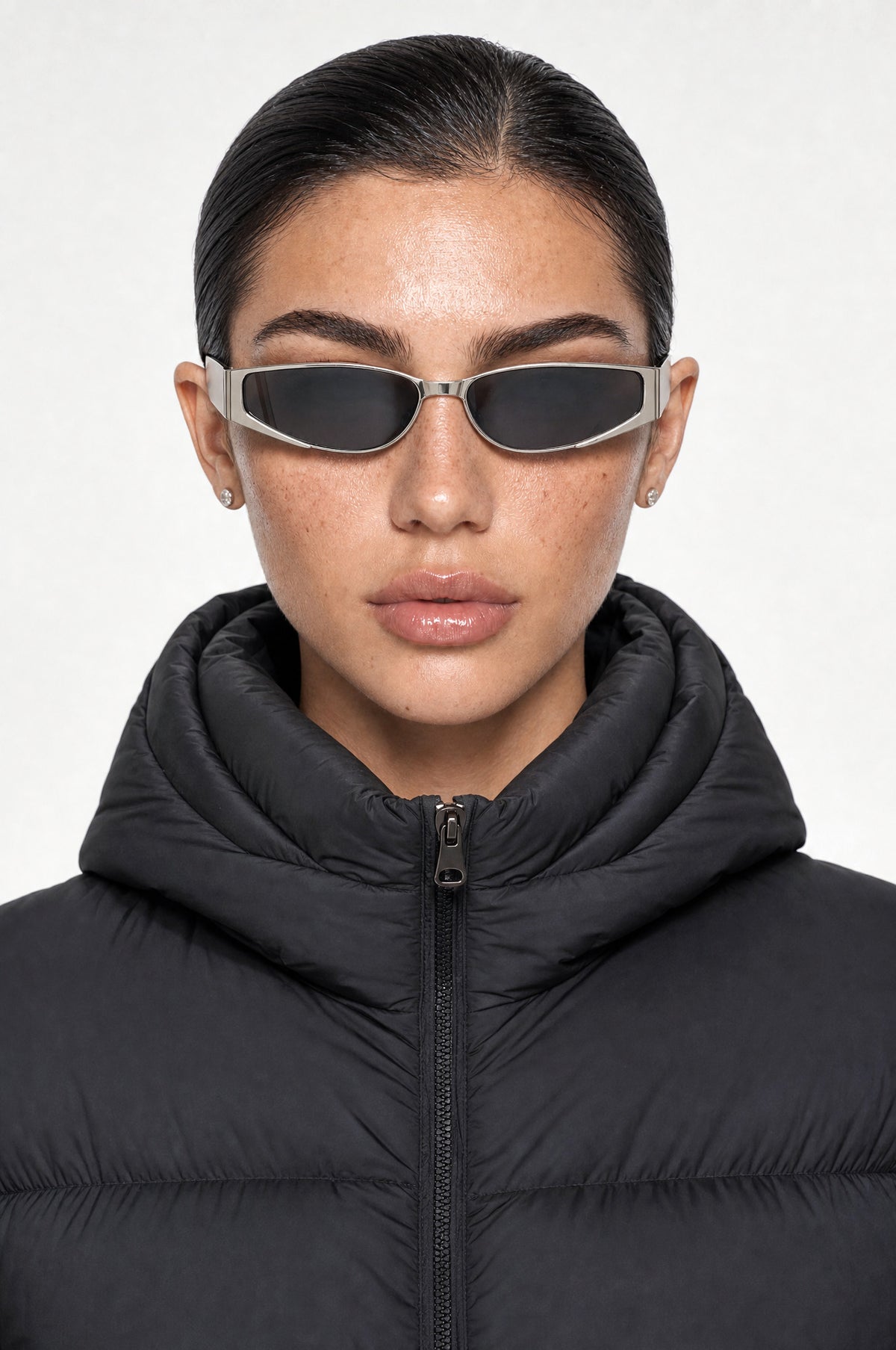 The Putney Wrap Sunglasses in Silver, worn, front