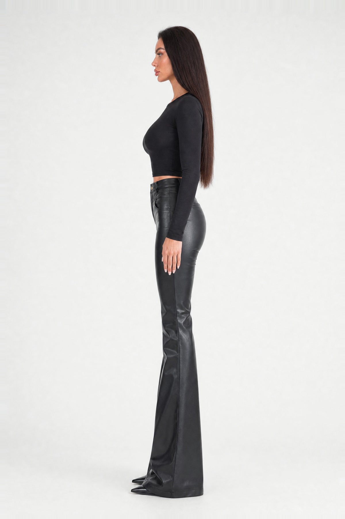 The Fulham Faux Leather Flared Trousers in Black, side profile