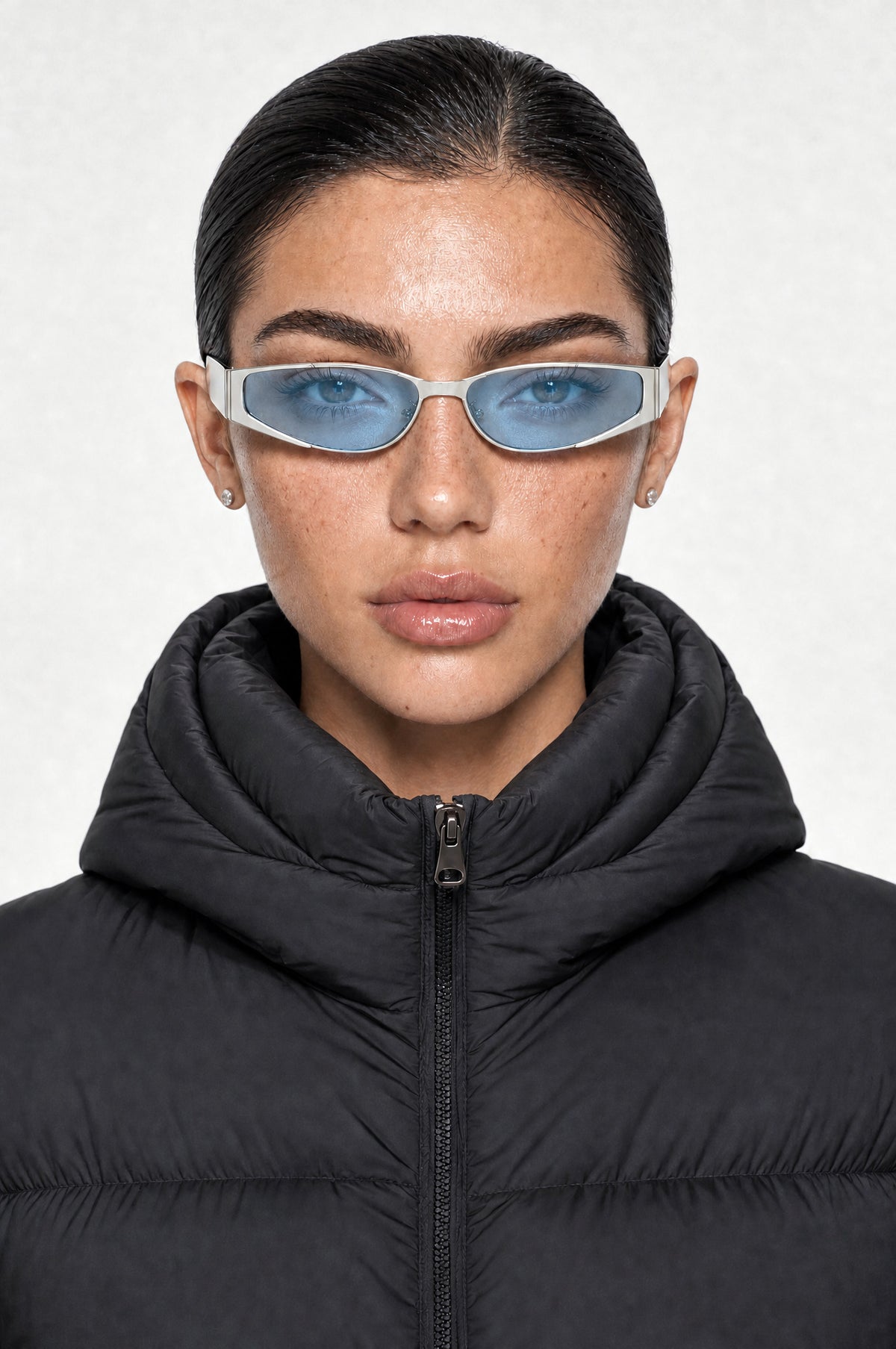 The Putney Wrap Sunglasses in Silver Blue, worn, front