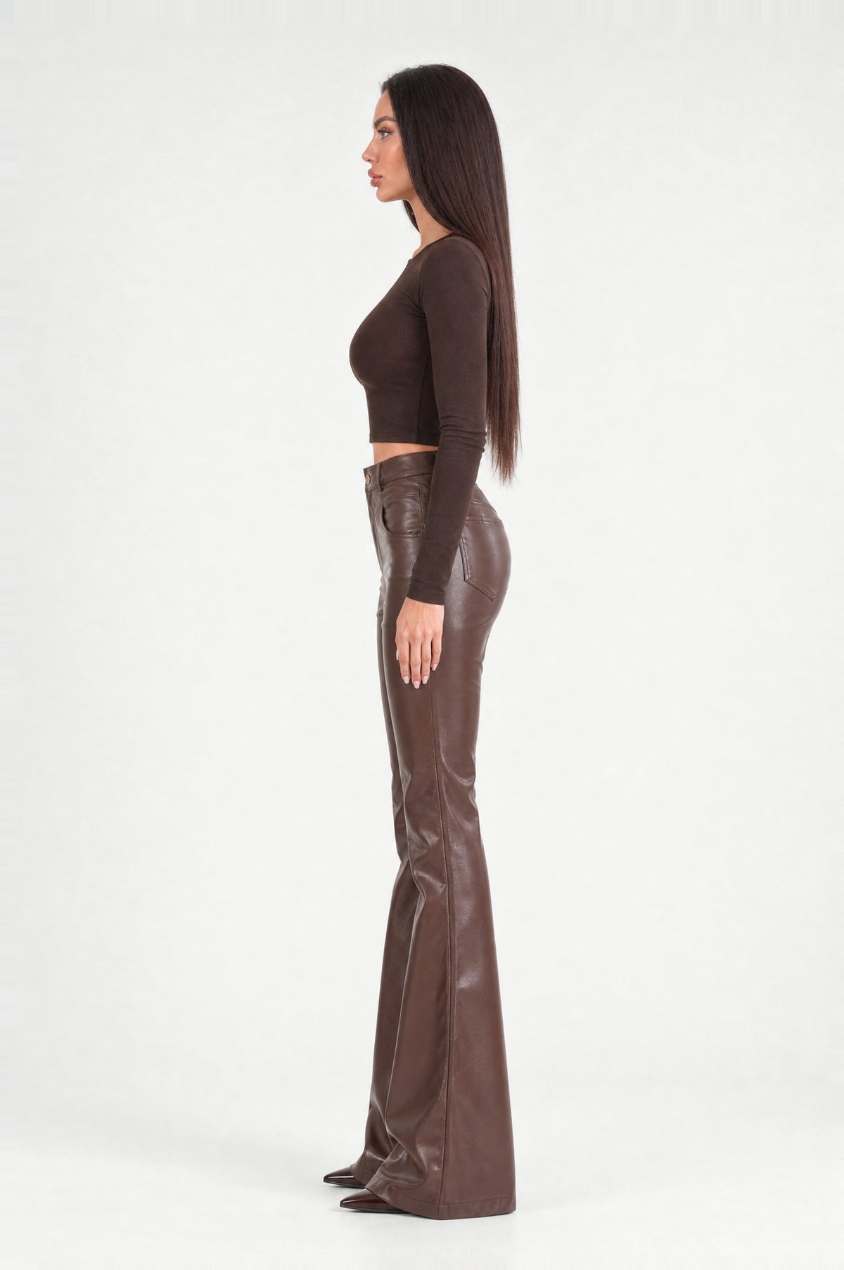 The Fulham Faux Leather Flared Trousers in Coffee, side profile