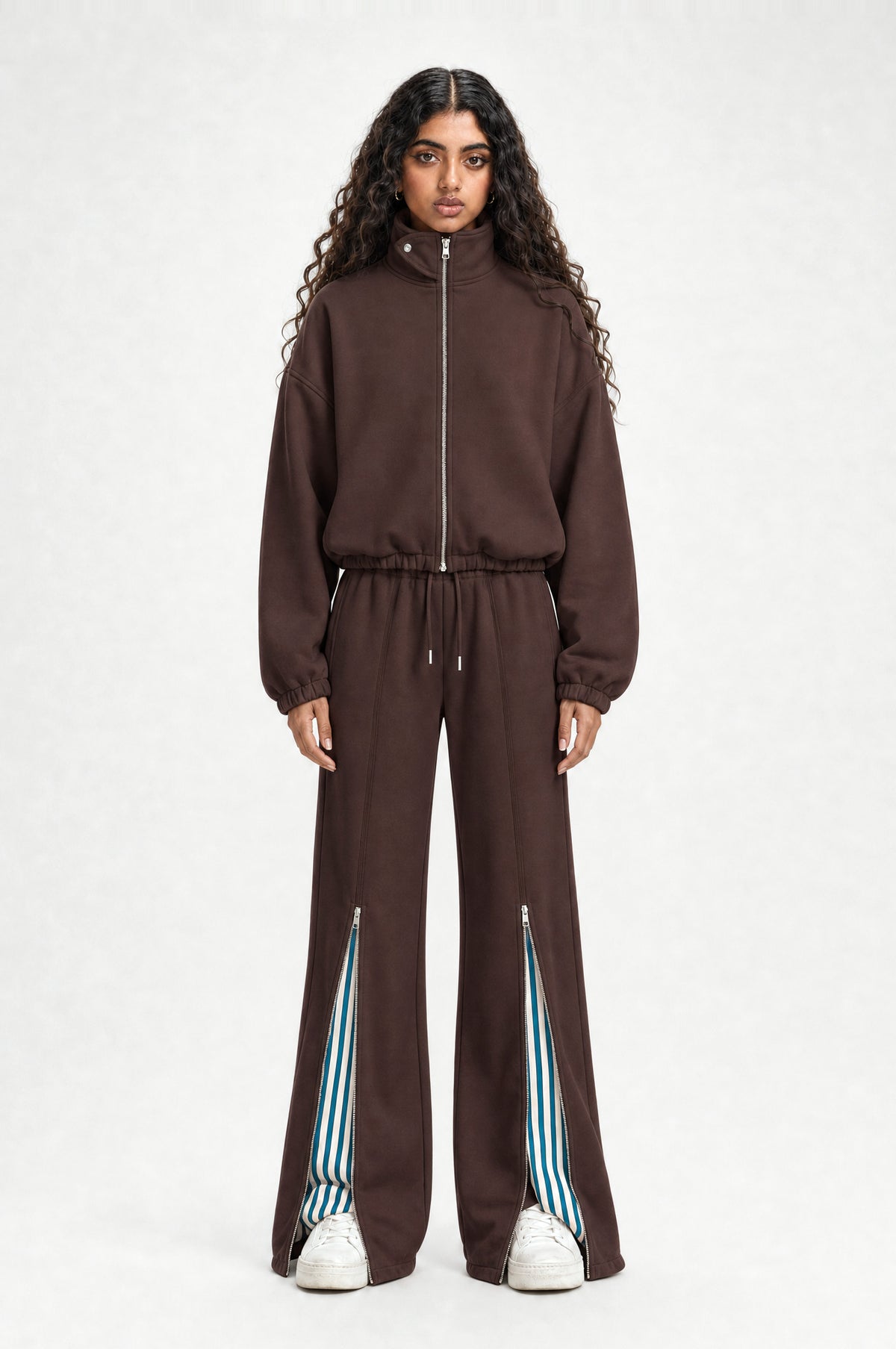 The Islington Zip Tracksuit in coffee, front view with blue-striped hem slits