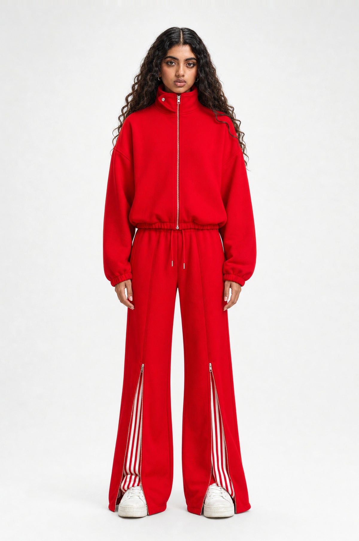 The Islington Zip Tracksuit in red, front view, jacket zipped to the funnel collar with wide-leg trousers